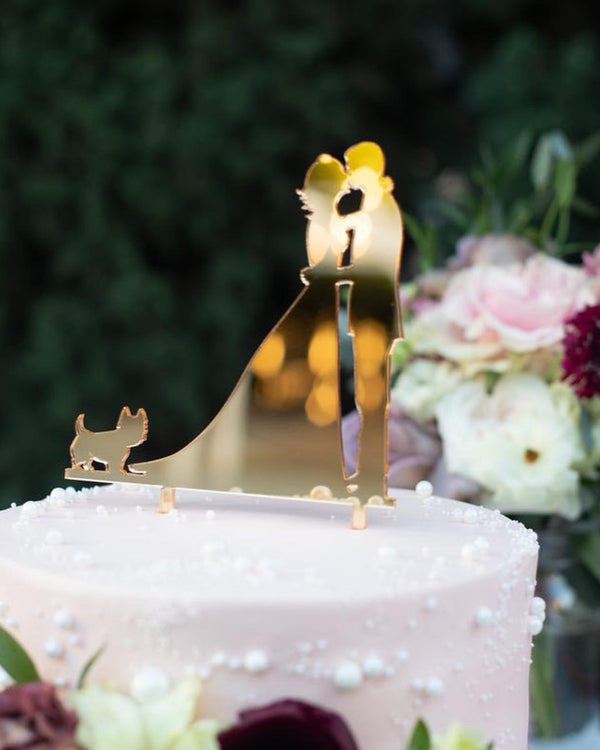 Custom acrylic wedding cake topper with couple in gold mirror