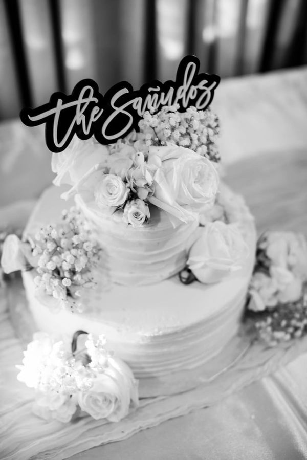 Double-layered acrylic wedding cake topper customized with names